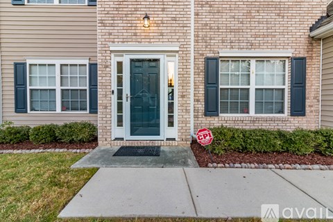 A house with a green door and a sign that says CPI.