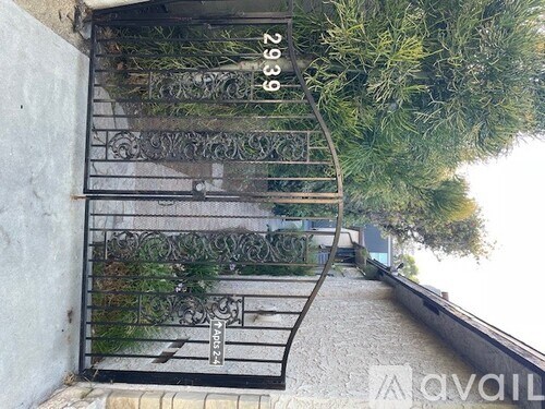 A metal staircase with a railing and steps leading up to a door.