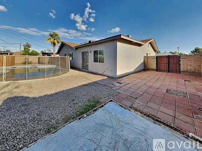A house with a pool in the backyard.