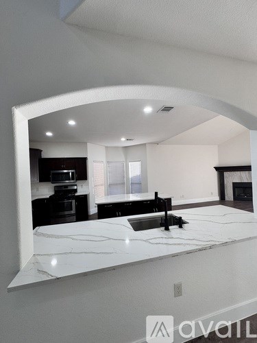 A modern kitchen with a large island in the middle.