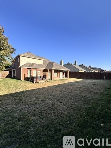 A house with a lawn in front of it.