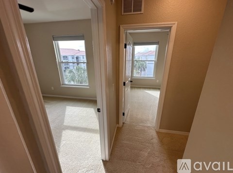 A hallway with two doors leading to different rooms.