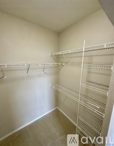 Empty white shelves in a room.