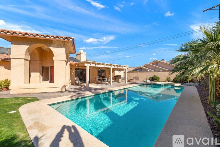 A house with a pool in the backyard.