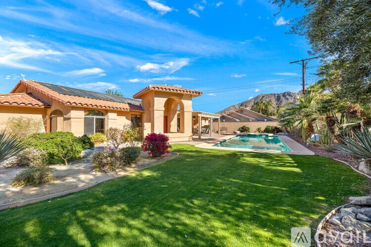 A house with a pool in the backyard.