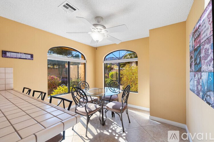 A patio with a table and chairs is available for rent.