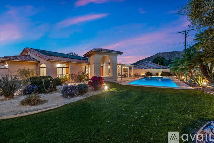 A beautiful house with a pool in the backyard.
