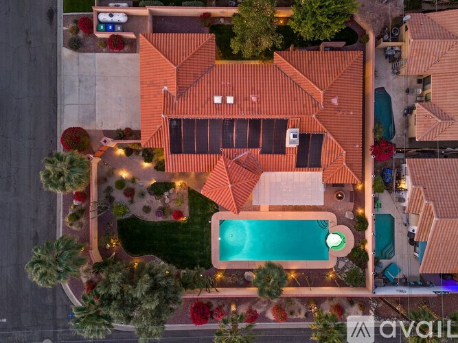 A large house with a pool in the backyard.