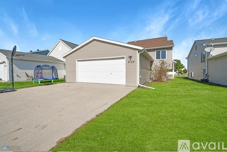 A house with a garage is for sale.