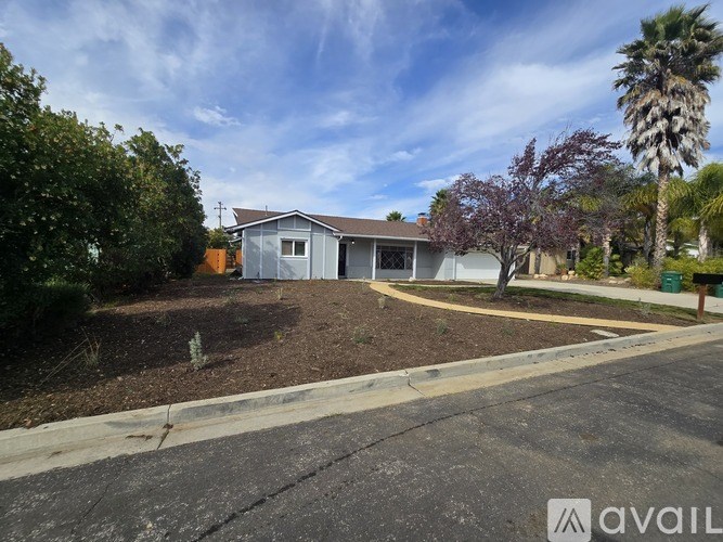 A house with a driveway in front of it.