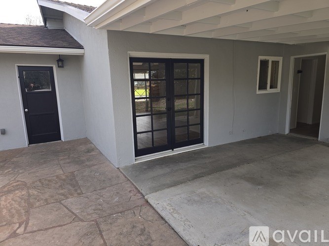 A house with a black door and a glass window.