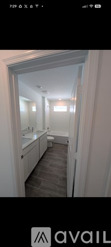 A bathroom with a sink and mirror.