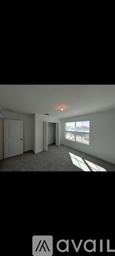 A room with a window and a door is shown.