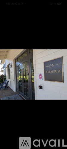 A sign on a building that says "LAKEHOUSE".