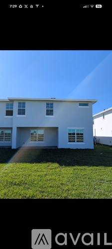 A white house with a blue sky in the background.