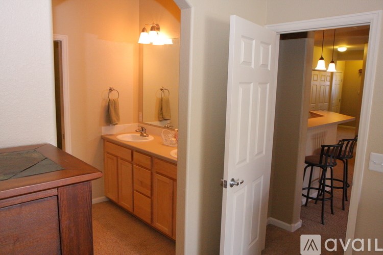 A bathroom with a sink and mirror.