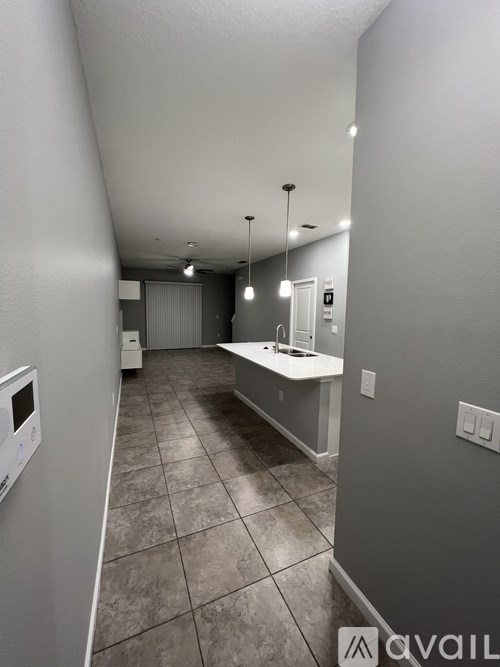 A bathroom with a sink and mirror.