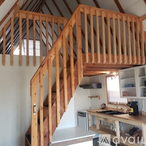 A wooden staircase with a counter below it.