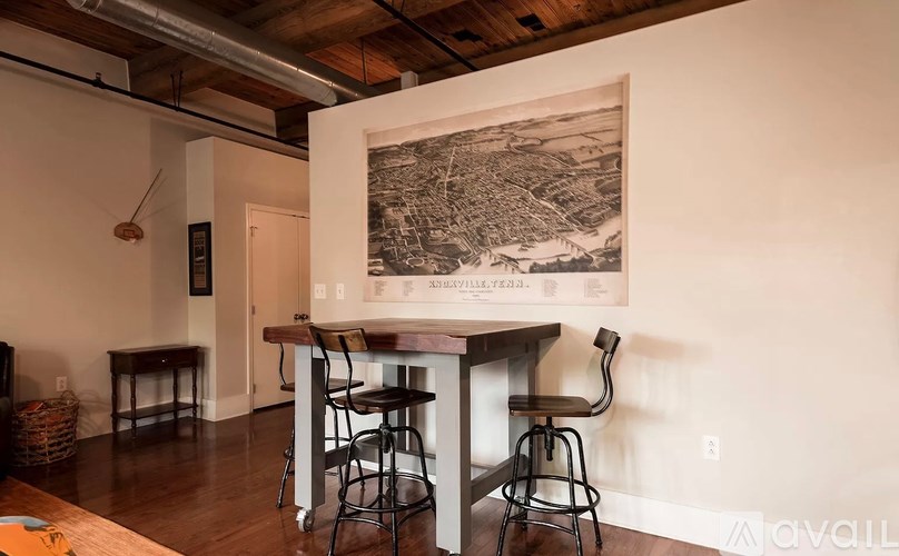 A bar area with a large framed map above it.