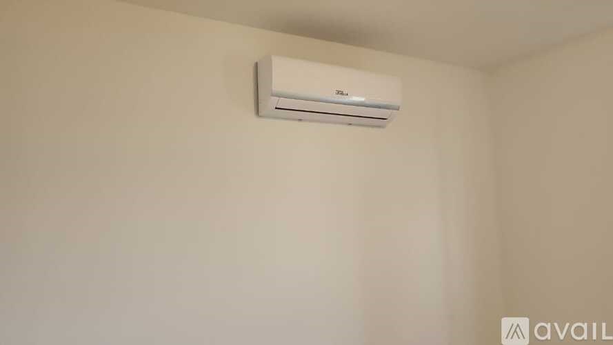A wall-mounted air conditioner is installed on the wall.