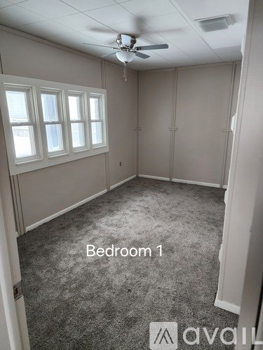 Bedroom 1 is empty and ready for furniture.