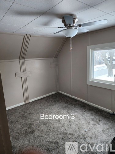 Bedroom 3 has a ceiling fan and a window.