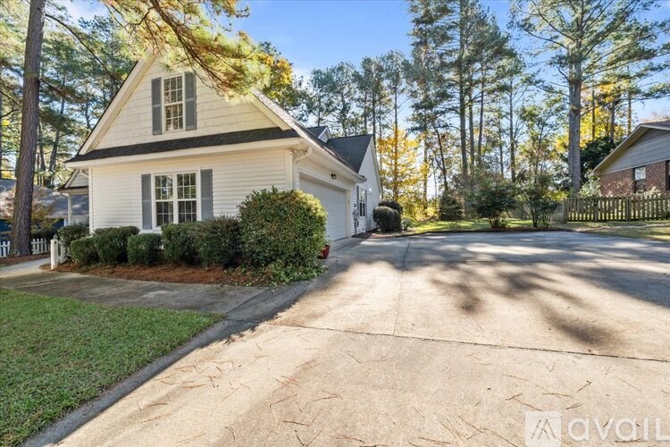 A house with a driveway in front of it.
