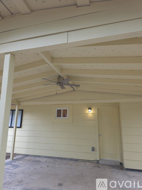 A house with a fan on the roof.