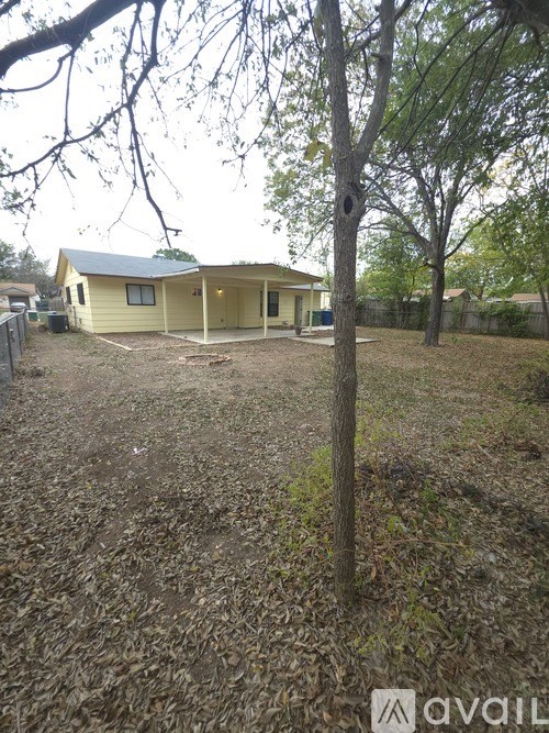 A house with a tree in front of it.