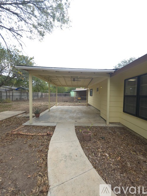 A small house with a covered patio area.