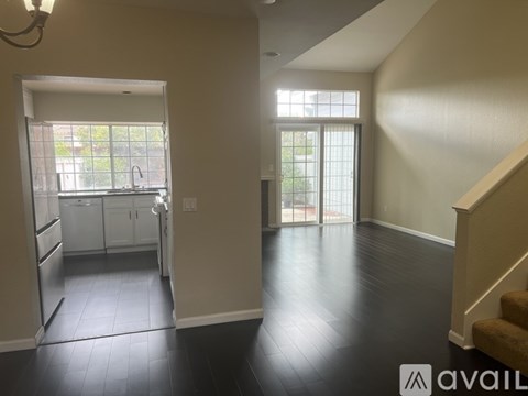A kitchen with a sink and a window.