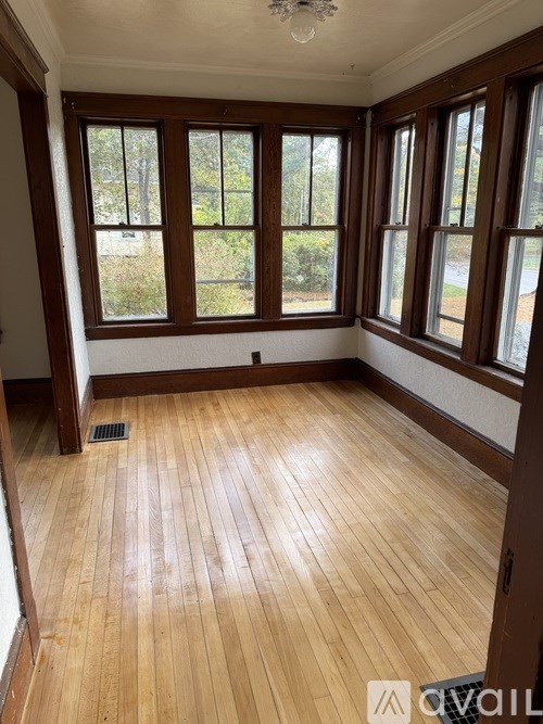 A room with wooden floors and windows.