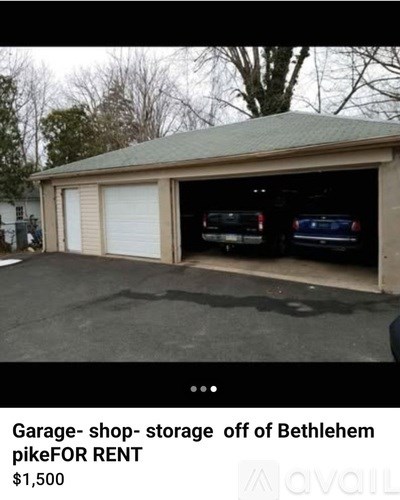 A garage with a sign that says "Garage- shop- storage off of Bethlehem pikeFOR RENT $1,500".