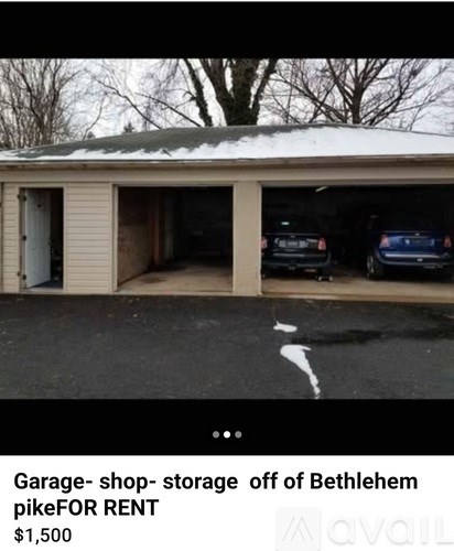 A garage with a sign that says "Garage- shop- storage off of Bethlehem pikeFOR RENT $1,500".