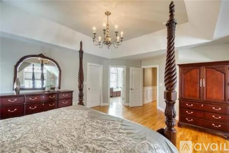 A bathroom with a white tub and a walk in shower.