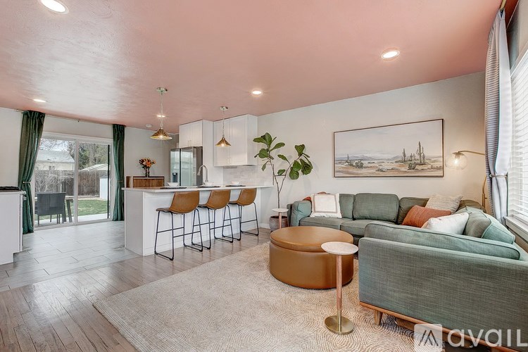 A living room with a bar area and a couch.