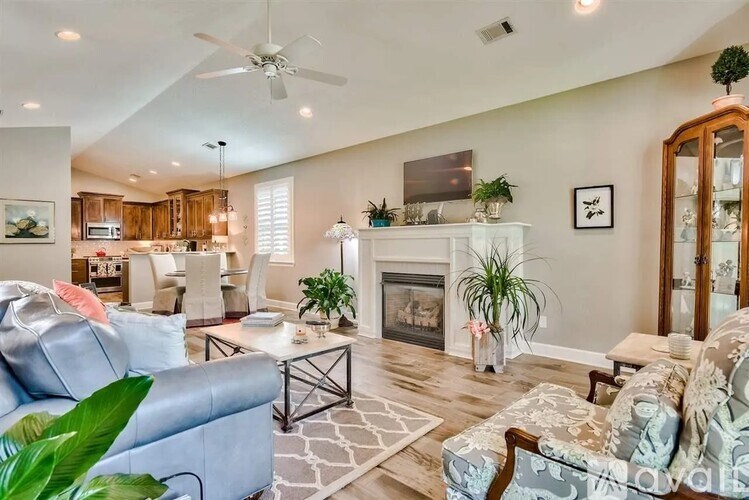 A living room with a fireplace and a couch.