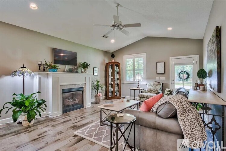A living room with a fireplace and a couch.