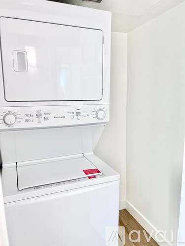 A white oven with a control panel on the front.