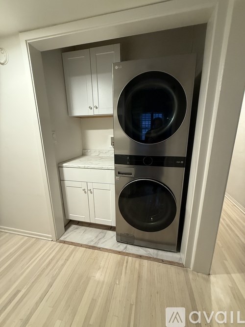 A washing machine and dryer in a small laundry room.
