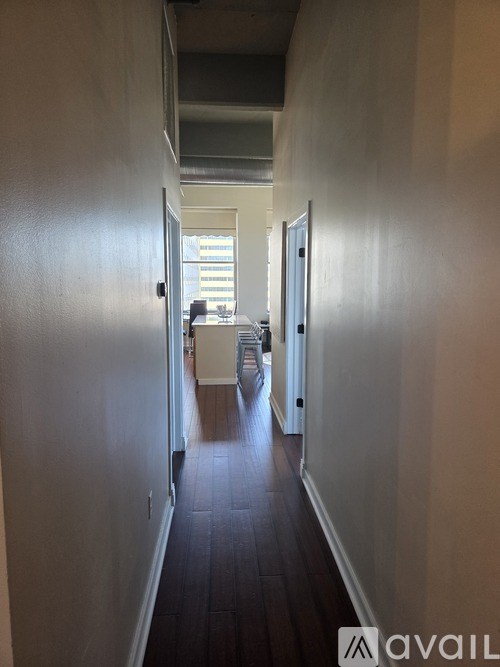 A long hallway with doors on both sides.