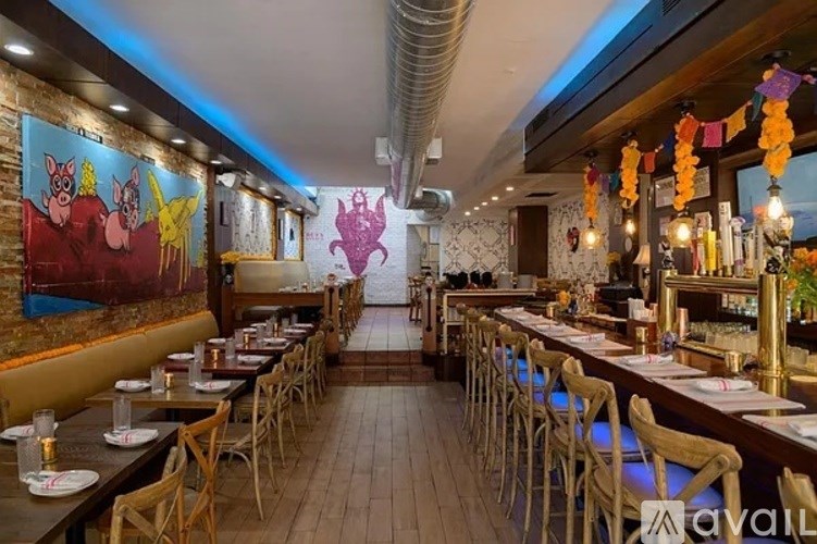 A restaurant with tables and chairs set up for dining.