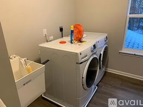 A white washer and dryer in a laundry room.