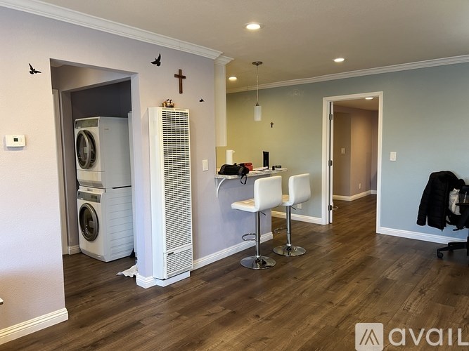 A room with a washer and dryer in it.