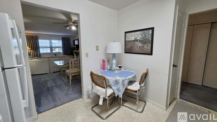 A dining area with a table set for four.