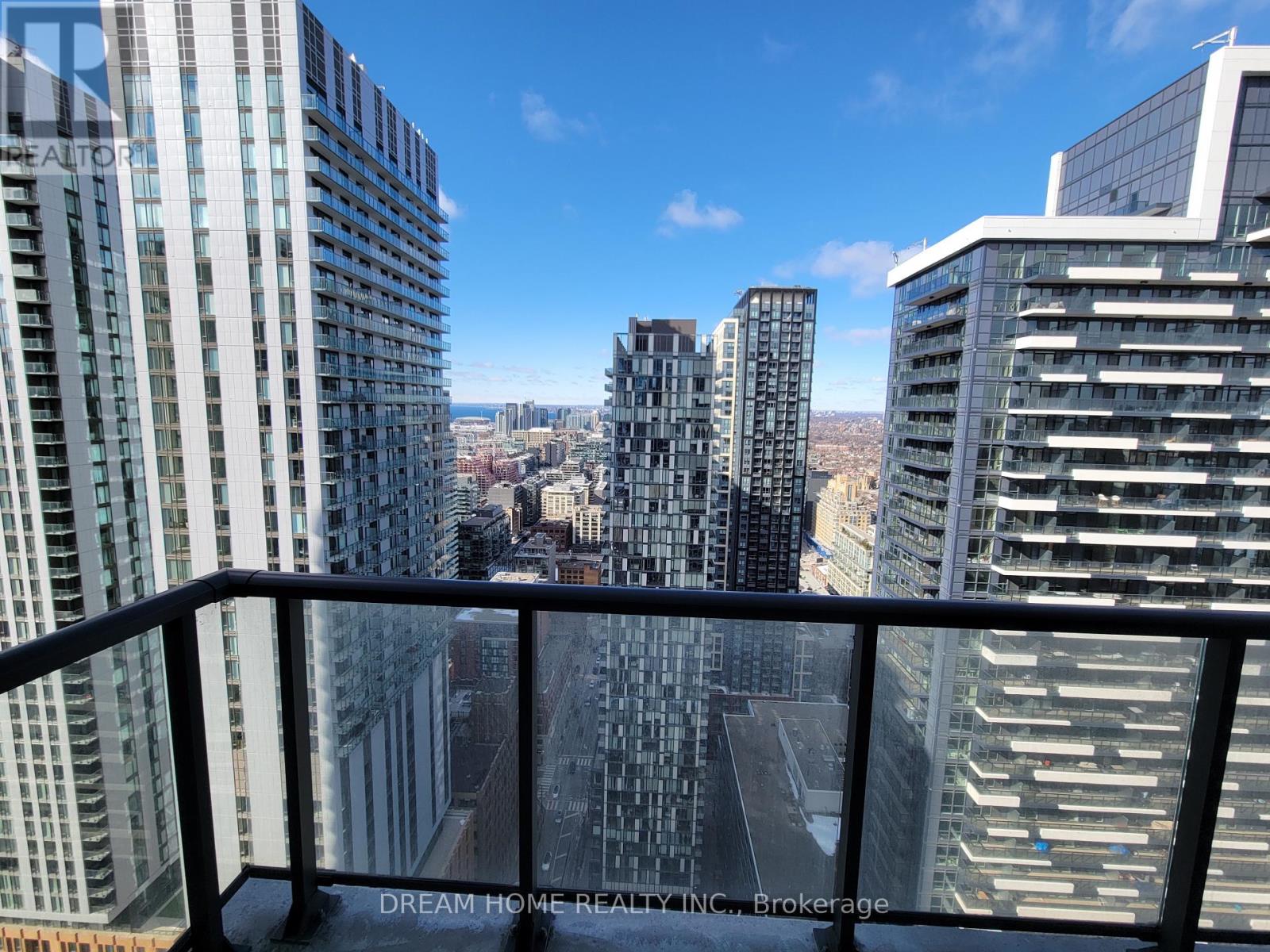 A cityscape with tall buildings and a clear sky.