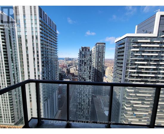 A cityscape with tall buildings and a clear sky.
