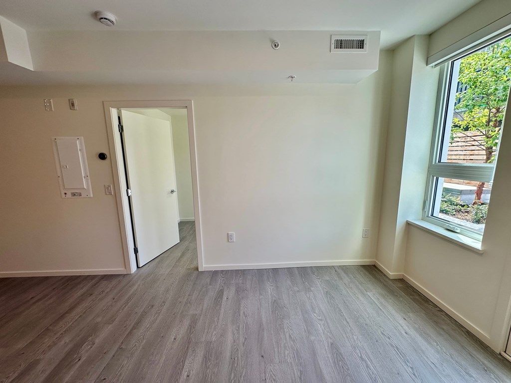 A room with a door and a window.