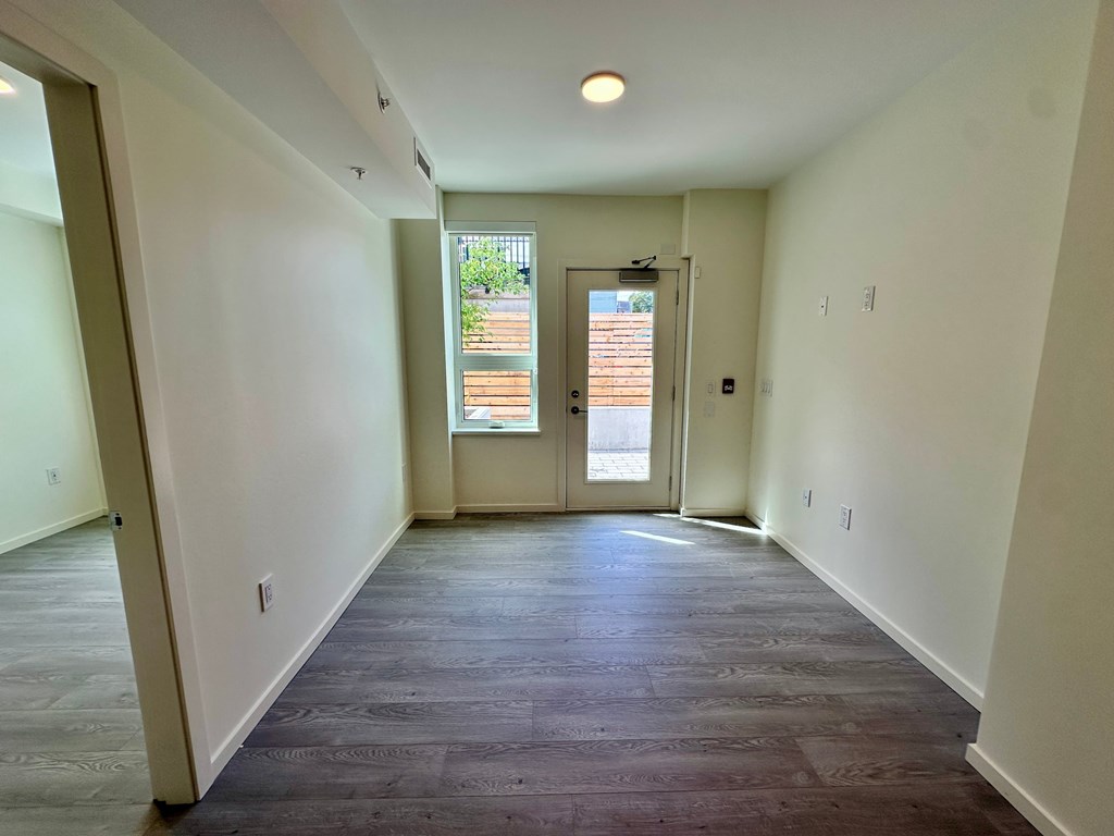 A long hallway with a door at the end.