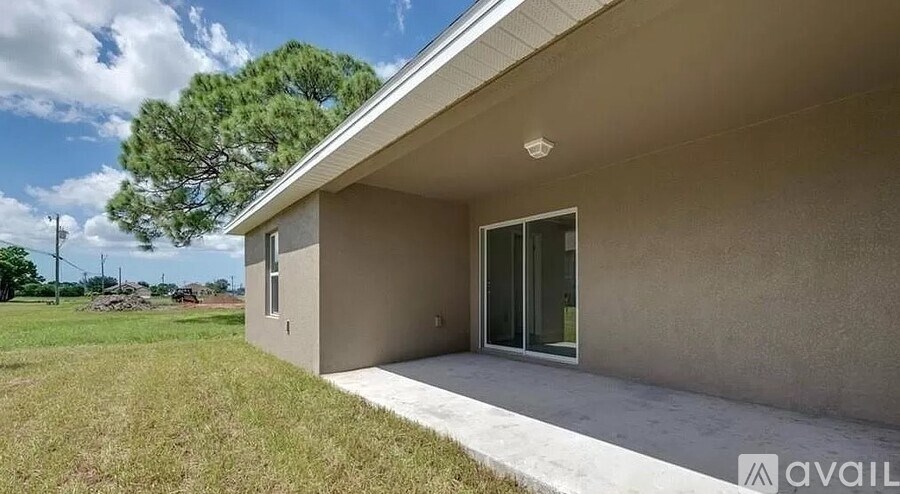 A house with a beige exterior is available for purchase.